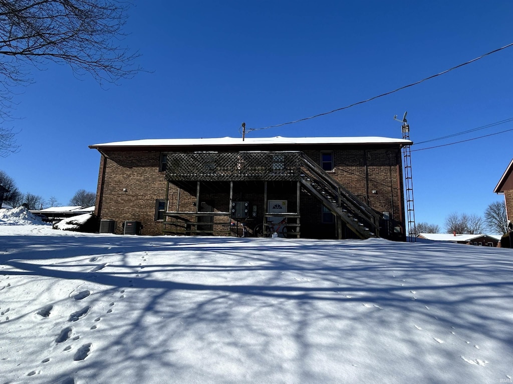 view of snow covered house