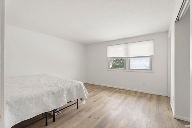 bedroom featuring light hardwood / wood-style flooring