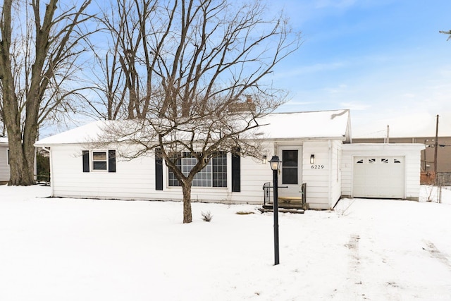 ranch-style house featuring a garage