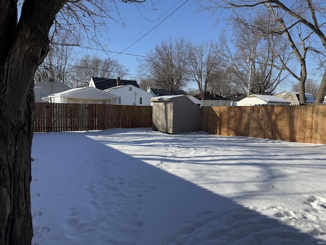 view of yard layered in snow