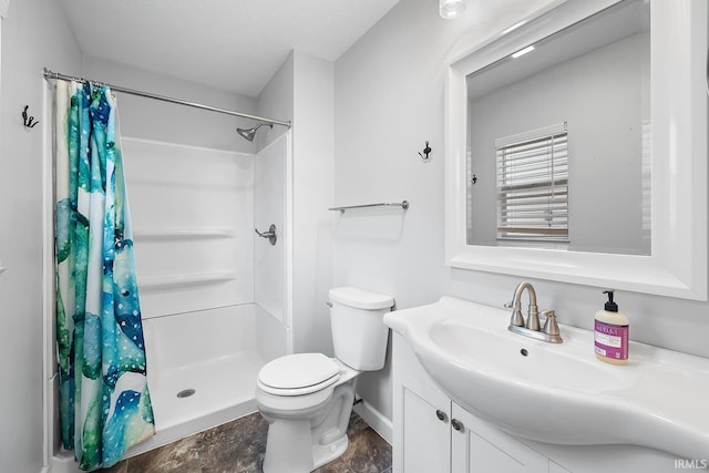 bathroom featuring a textured ceiling, toilet, vanity, and a shower with curtain