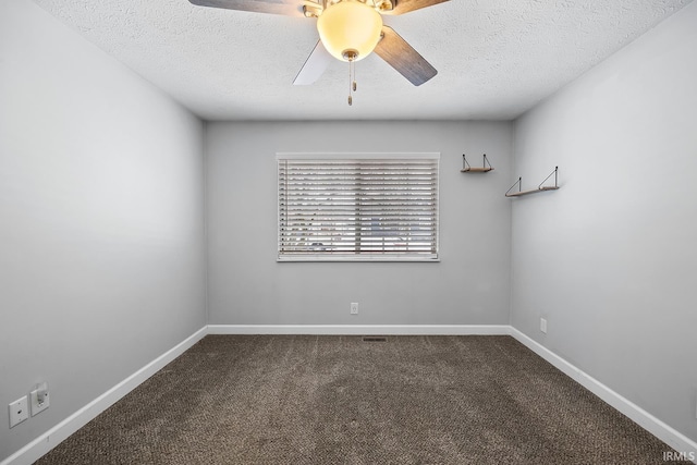 carpeted spare room featuring a textured ceiling and ceiling fan