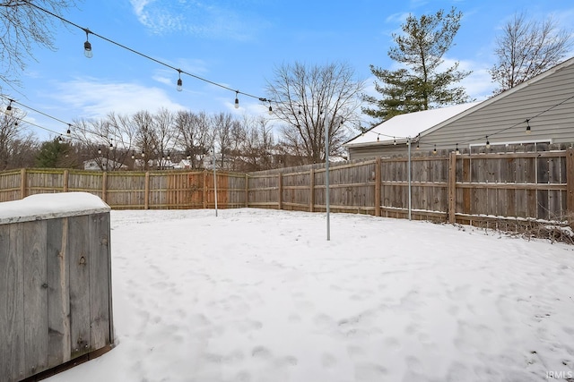 view of yard layered in snow