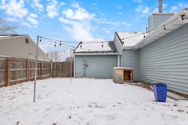 view of yard layered in snow