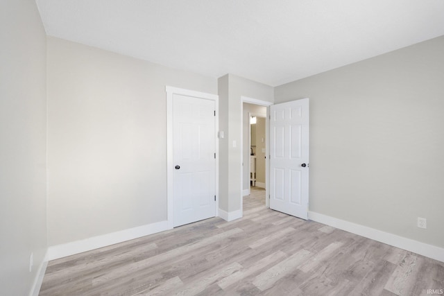 empty room with light hardwood / wood-style floors