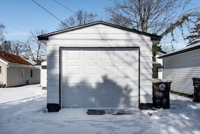 view of snow covered garage