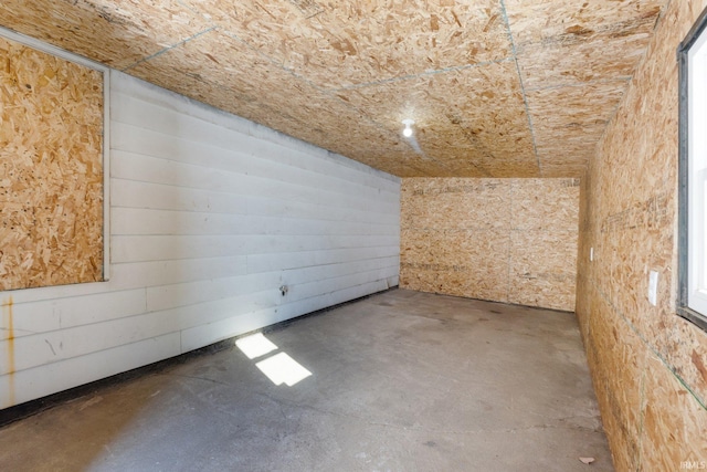 unfurnished room featuring concrete floors