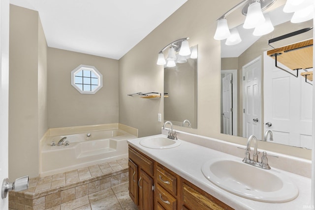 bathroom with vanity and a washtub