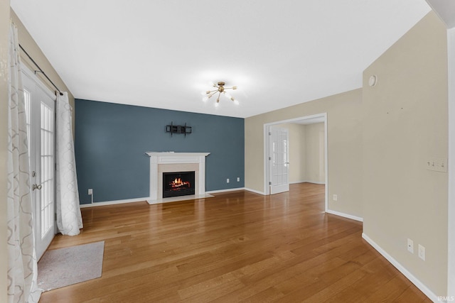 unfurnished living room with hardwood / wood-style flooring