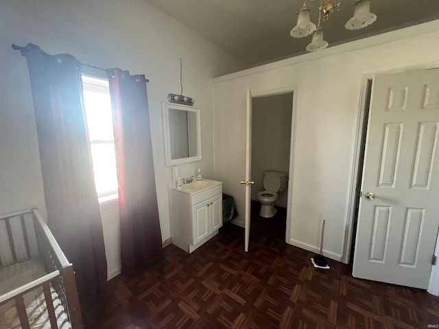 bedroom featuring dark parquet floors