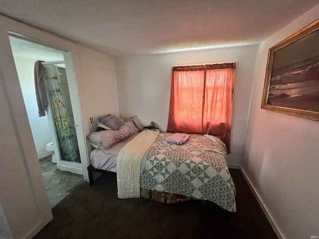 bedroom featuring a textured ceiling and carpet