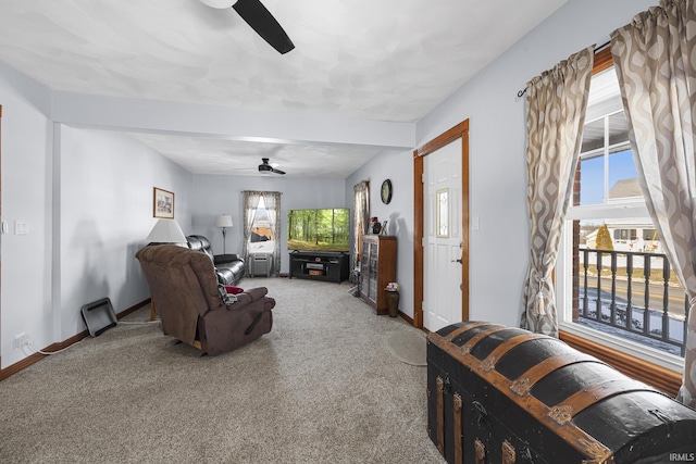 living room featuring ceiling fan and carpet floors