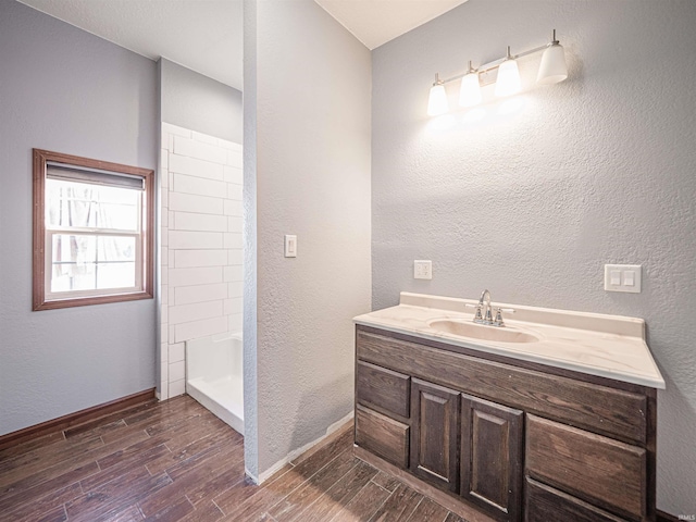 bathroom with vanity and walk in shower