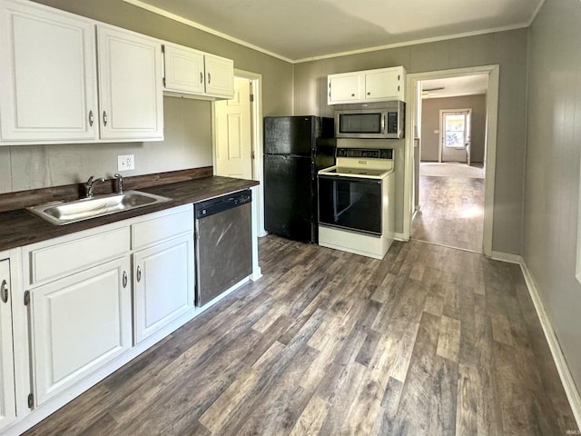 kitchen with white cabinetry, stainless steel appliances, dark wood-type flooring, ornamental molding, and sink