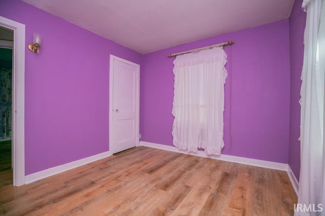 unfurnished room featuring light wood-type flooring