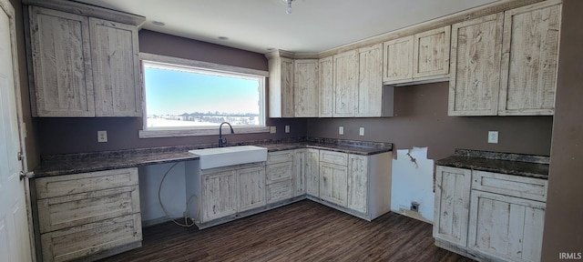 kitchen with dark wood-type flooring, sink, and cream cabinets