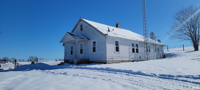 view of snow covered property