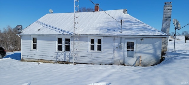 view of snow covered property