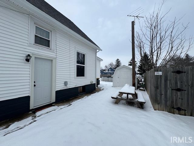 view of yard layered in snow