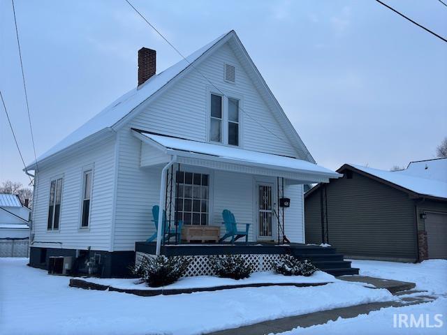 view of front of home with covered porch and a garage