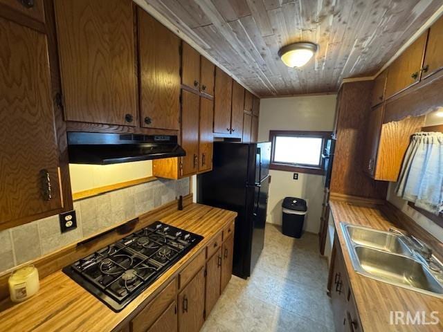 kitchen featuring wooden ceiling, sink, and black appliances