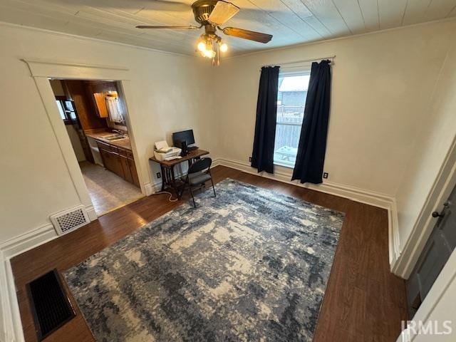 home office featuring wooden ceiling, ceiling fan, crown molding, and hardwood / wood-style flooring