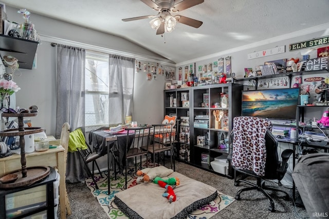 office area with lofted ceiling, ceiling fan, carpet floors, and a textured ceiling