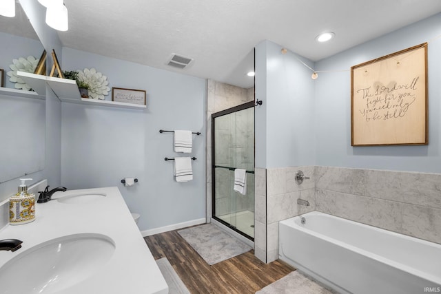 full bathroom with toilet, vanity, wood-type flooring, and plus walk in shower