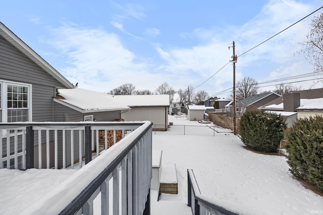 view of snow covered deck