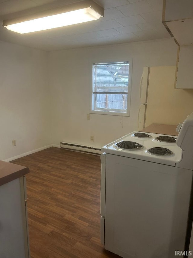 laundry room featuring a baseboard radiator and dark hardwood / wood-style floors