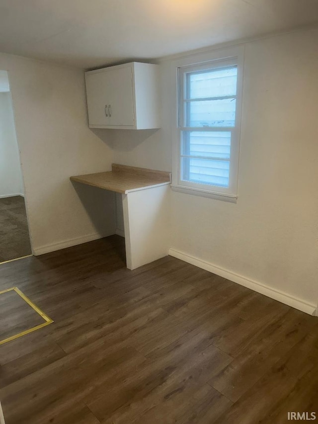 interior space with dark wood-type flooring