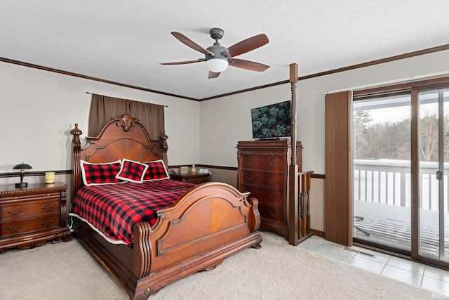 bedroom featuring ceiling fan, access to exterior, a textured ceiling, and light tile patterned floors