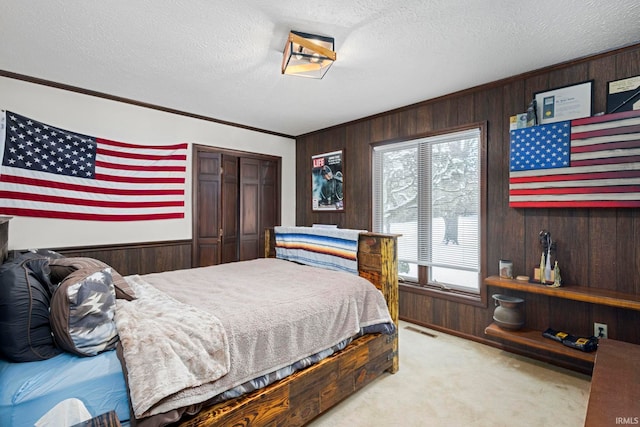 bedroom featuring a textured ceiling and multiple windows