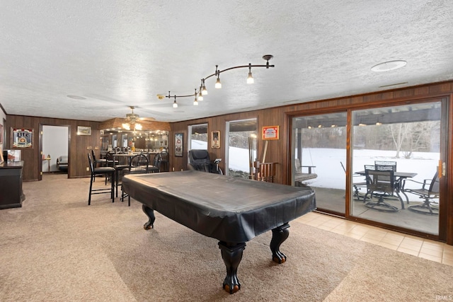 game room featuring ceiling fan, light colored carpet, a textured ceiling, and billiards