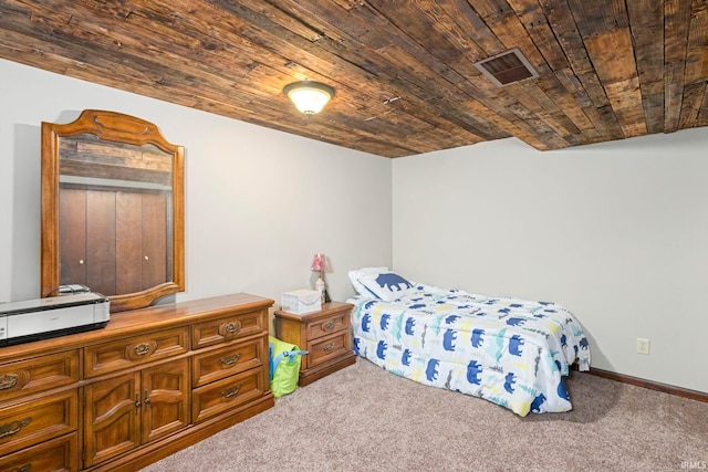 carpeted bedroom with wood ceiling