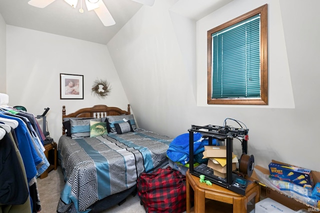 bedroom featuring ceiling fan, lofted ceiling, and carpet floors