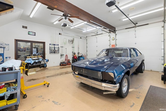 garage featuring ceiling fan and a garage door opener