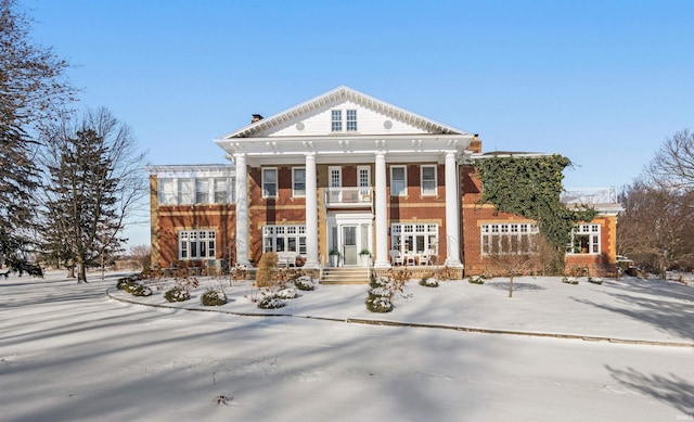 view of front of property with a balcony