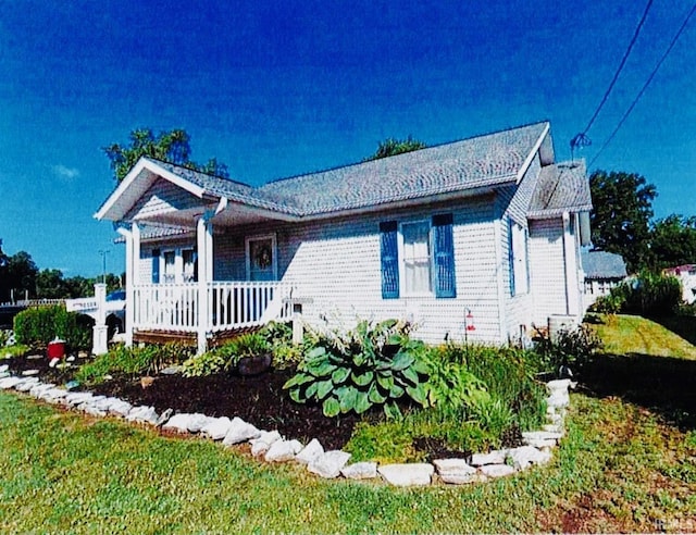 view of front of home with a front lawn and a porch