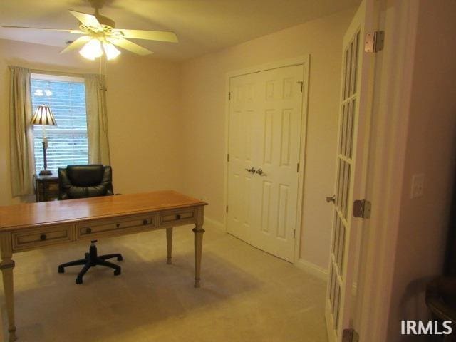 office space with ceiling fan and light colored carpet