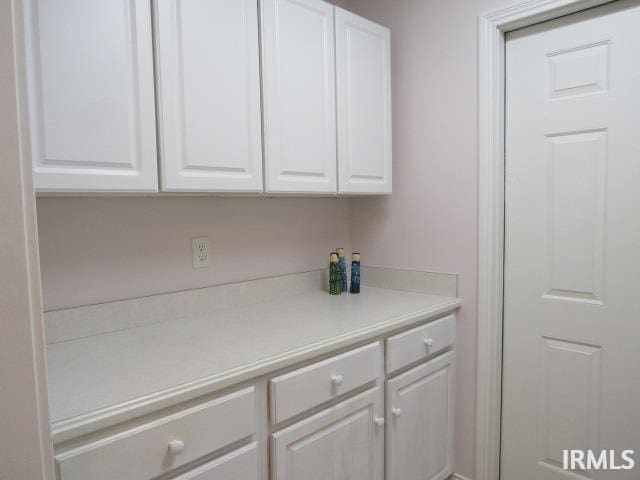 interior space with white cabinetry