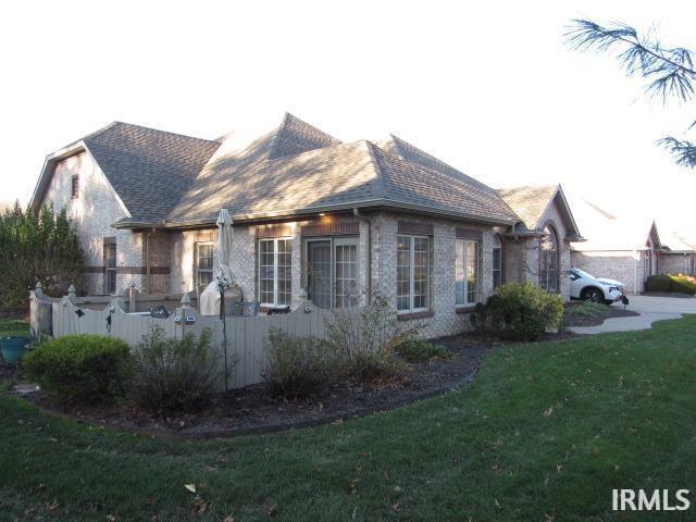 view of home's exterior with a yard