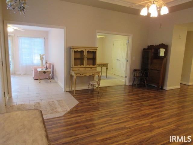 interior space featuring dark hardwood / wood-style floors and a chandelier