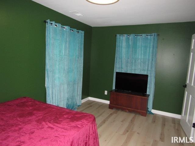 bedroom featuring light hardwood / wood-style floors