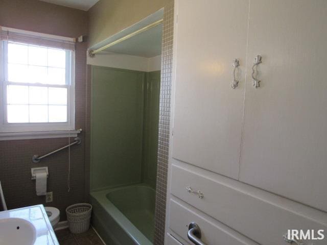 full bathroom featuring toilet, shower / bath combination, and vanity