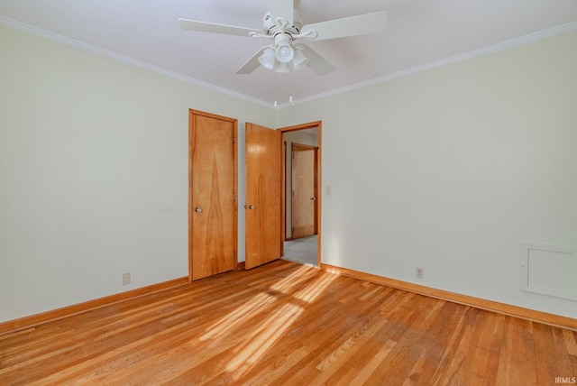 spare room with ceiling fan, ornamental molding, and light hardwood / wood-style floors