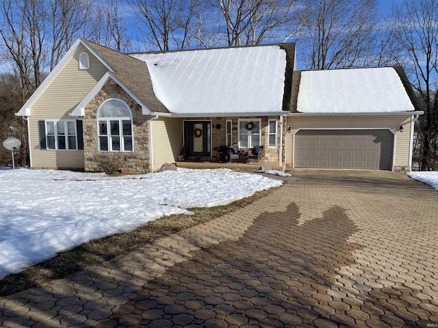 view of front of home featuring covered porch and a garage