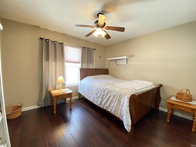 bedroom with ceiling fan and dark wood-type flooring