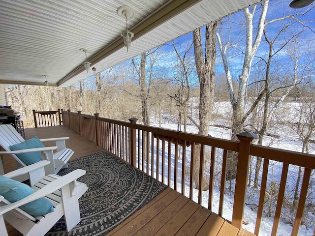 snow covered deck with area for grilling