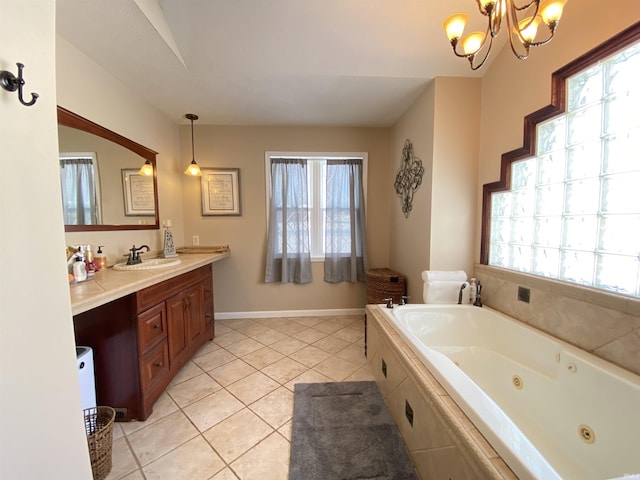 bathroom with vanity, tile patterned flooring, an inviting chandelier, and a relaxing tiled tub